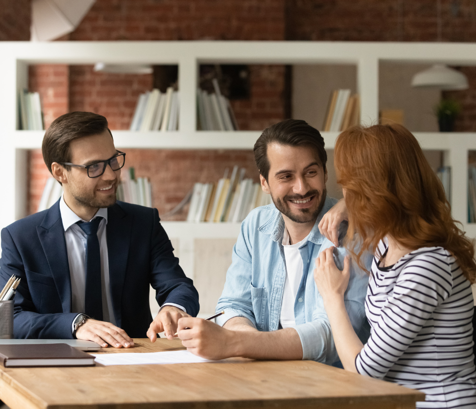 a couple closing up deals with a real estate agent