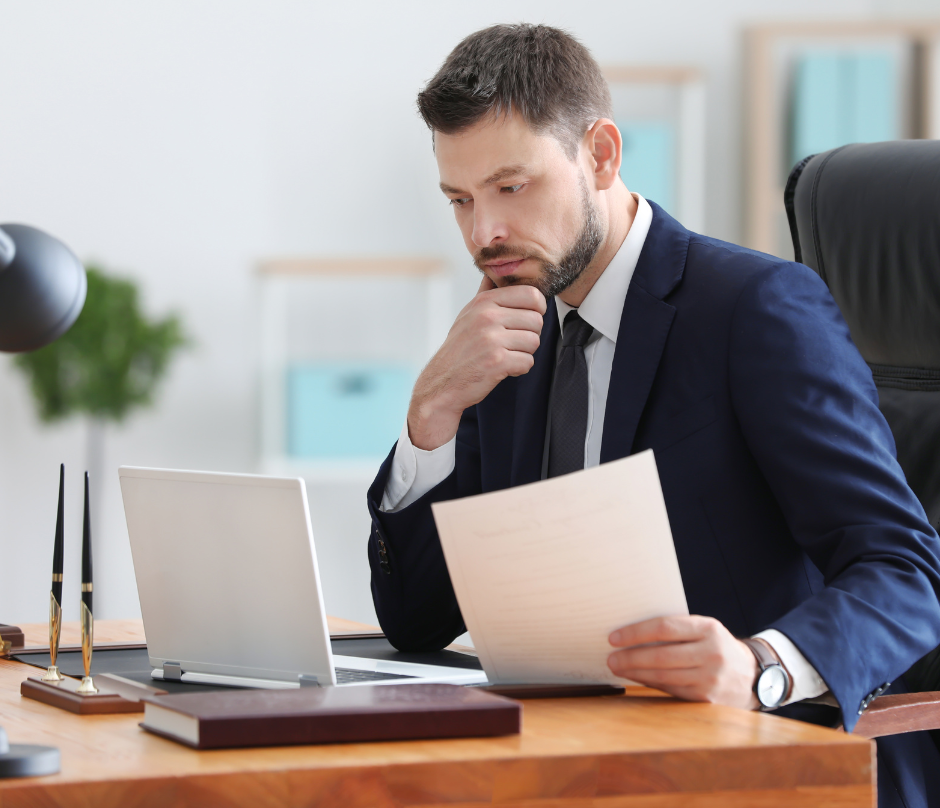 male notary signing agent working in the office