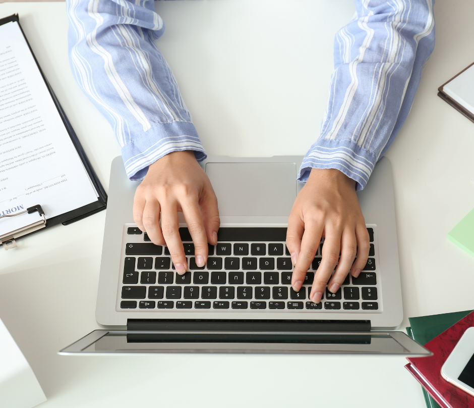 real estate agent working on a laptop
