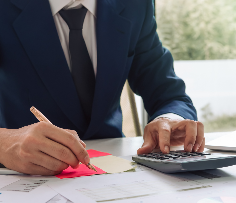 a man using his calculator to do some calculations