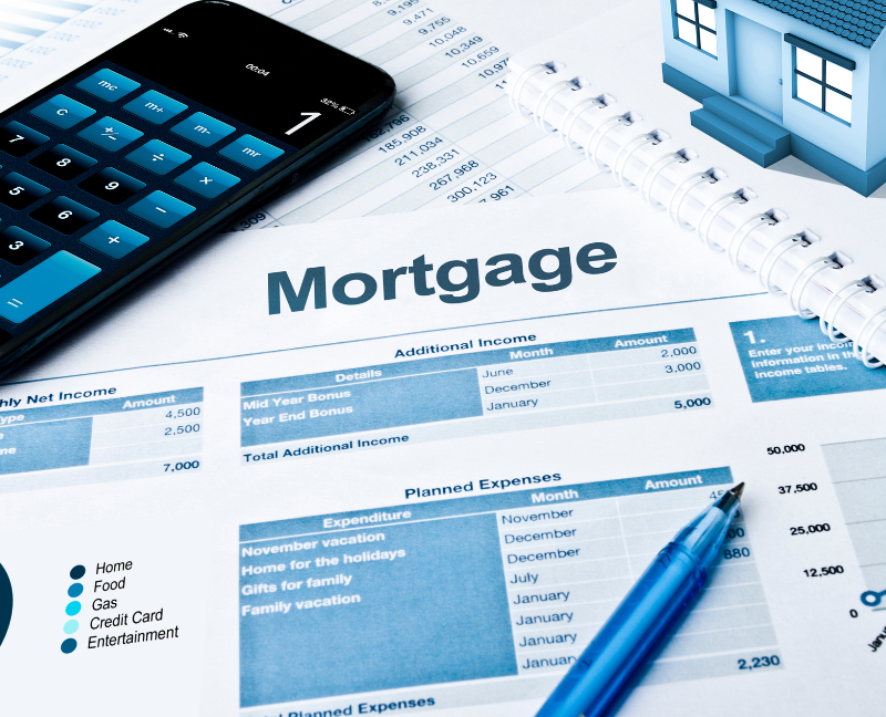 mortgage papers with phone and pen