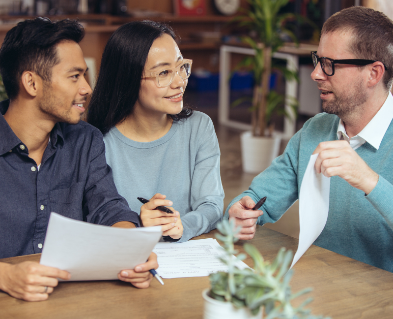 agents talking to couple about home equity loan plan