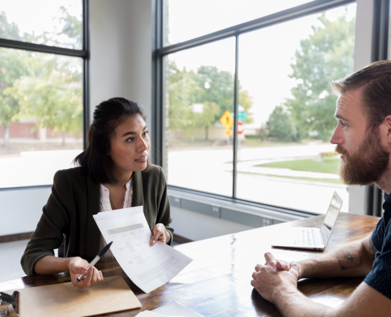 loan officer holding application for client