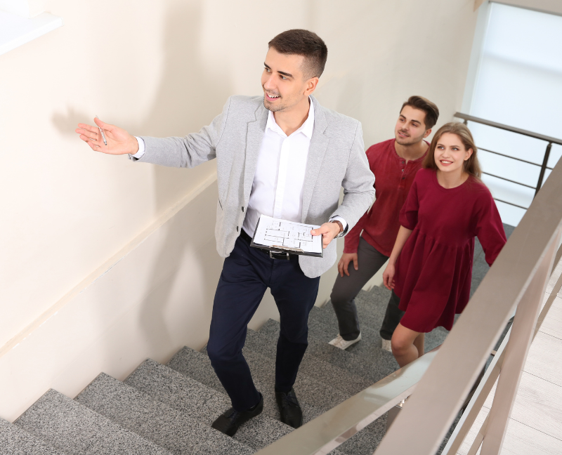 realtor showing couple the home