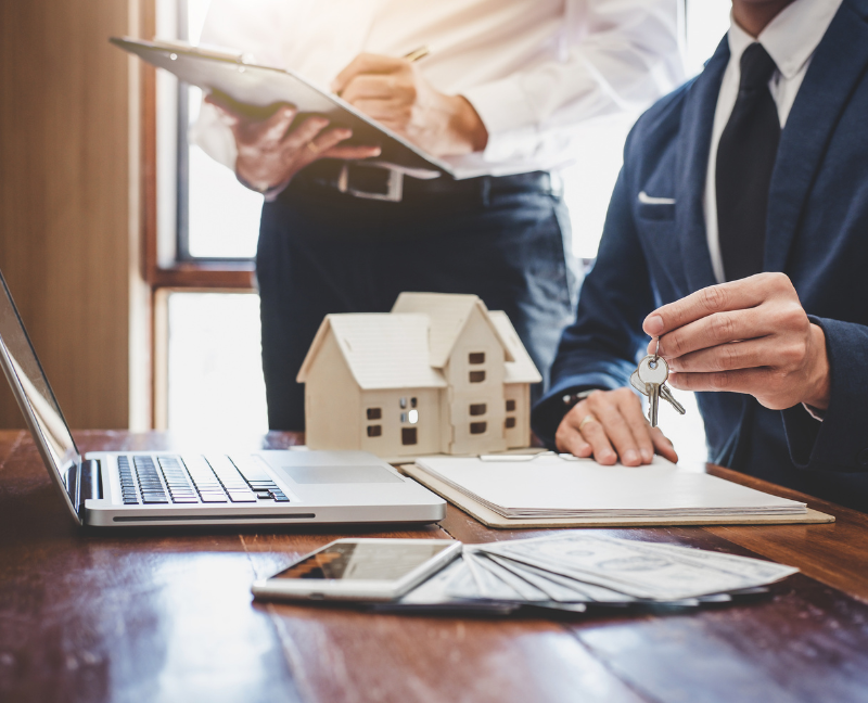 real estate agent with home buyer sigining a contract