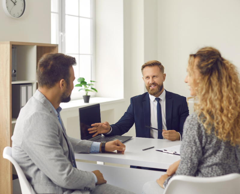 real estate agent talking to clients