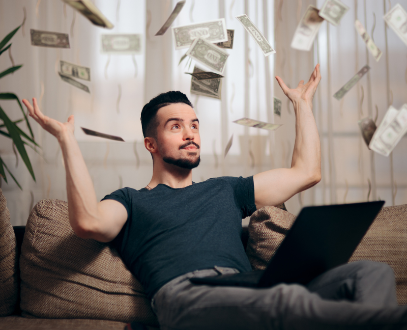 man throwing money in the air