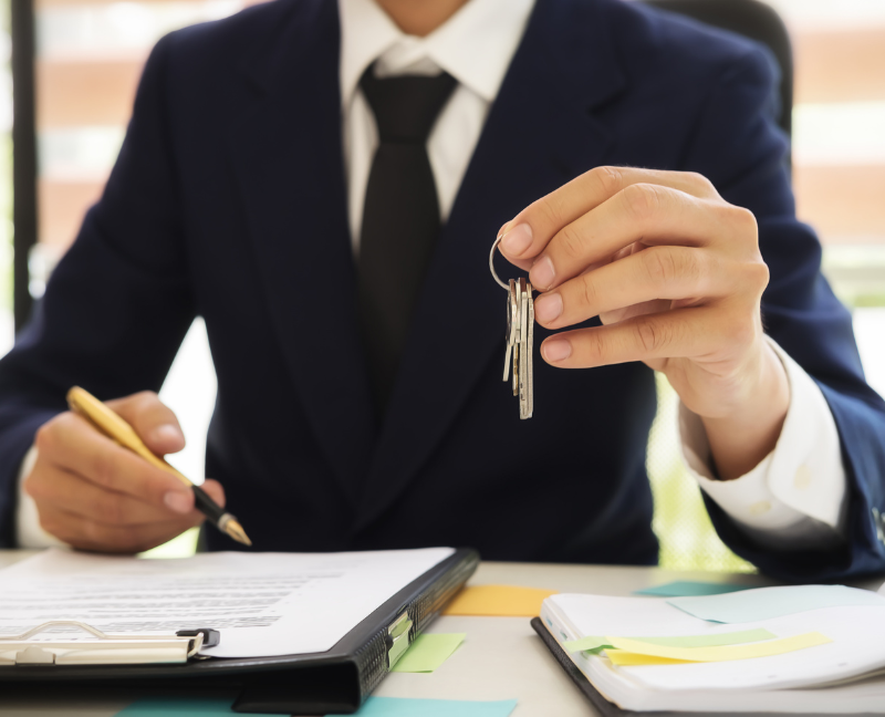close up of real estate agent holding a key