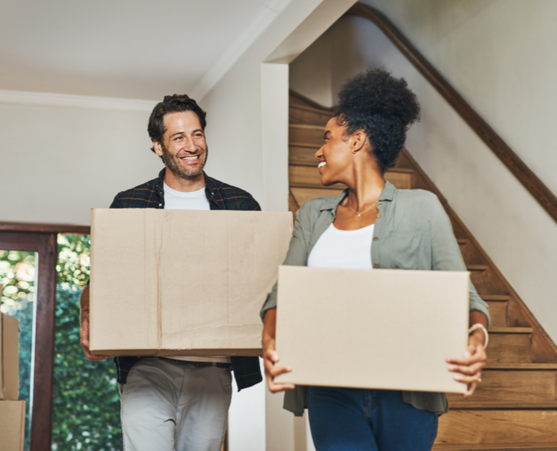 couple homeowners with moving boxes
