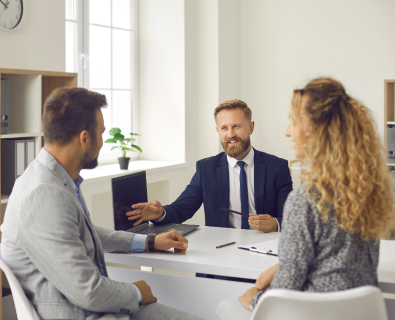title company agent talking to new homeowners
