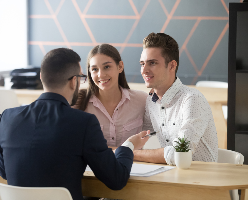 title company agent talking to couple