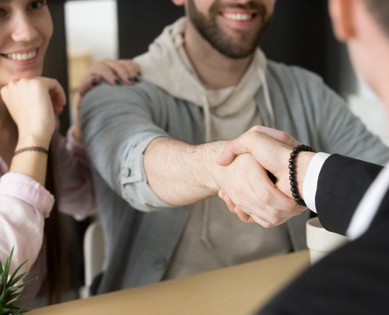 homebuyer shaking hand of real estate agent