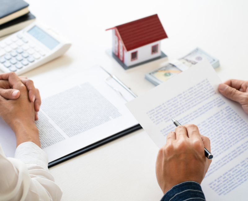 title insurance agent explaining forms to homebuyer