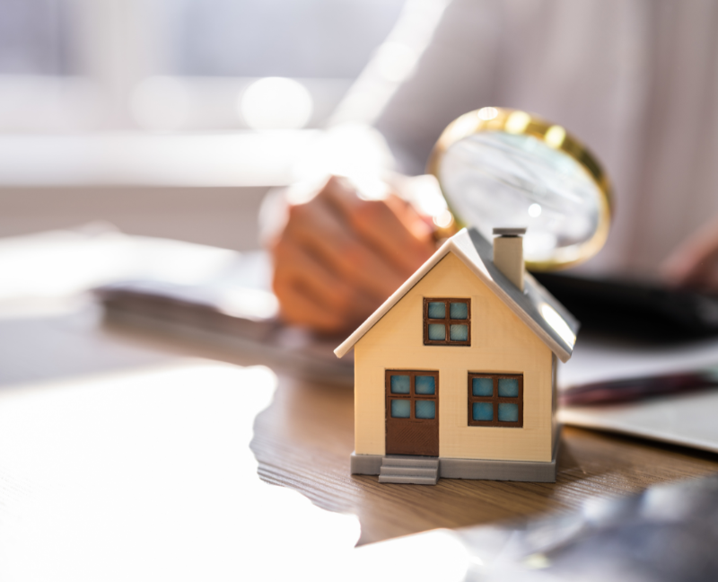 house inspection with magnifying glass