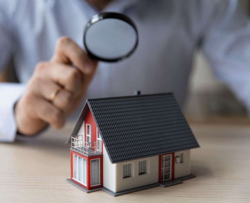 house miniature and magnifying glass