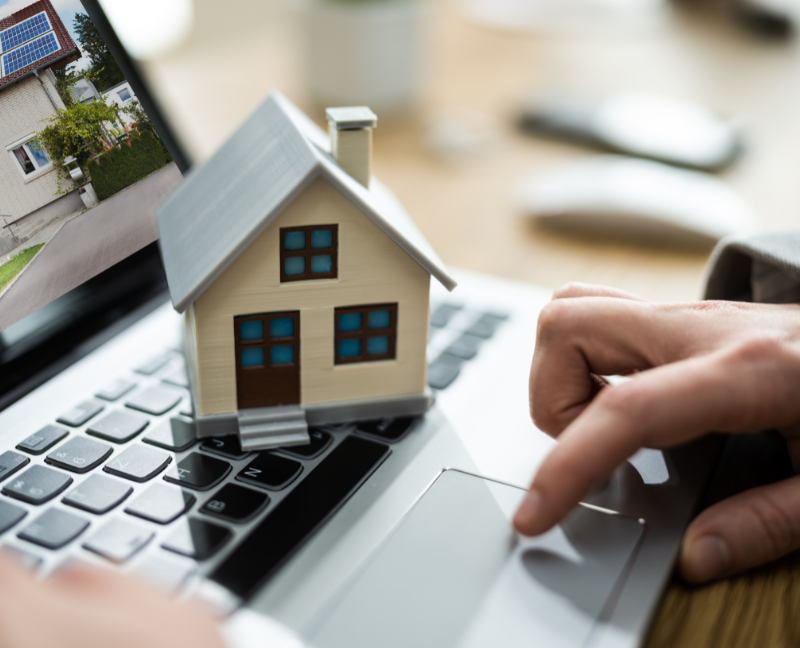 house miniature and laptop