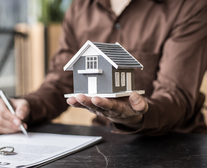 signing a contract and house miniature