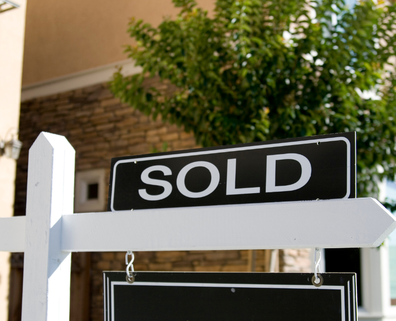 home with sold sign