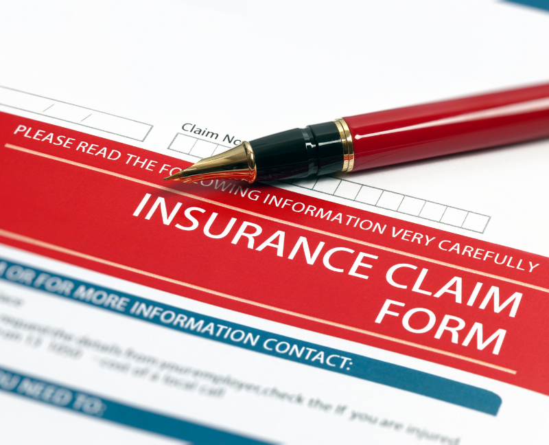 home insurance claim form with red pen