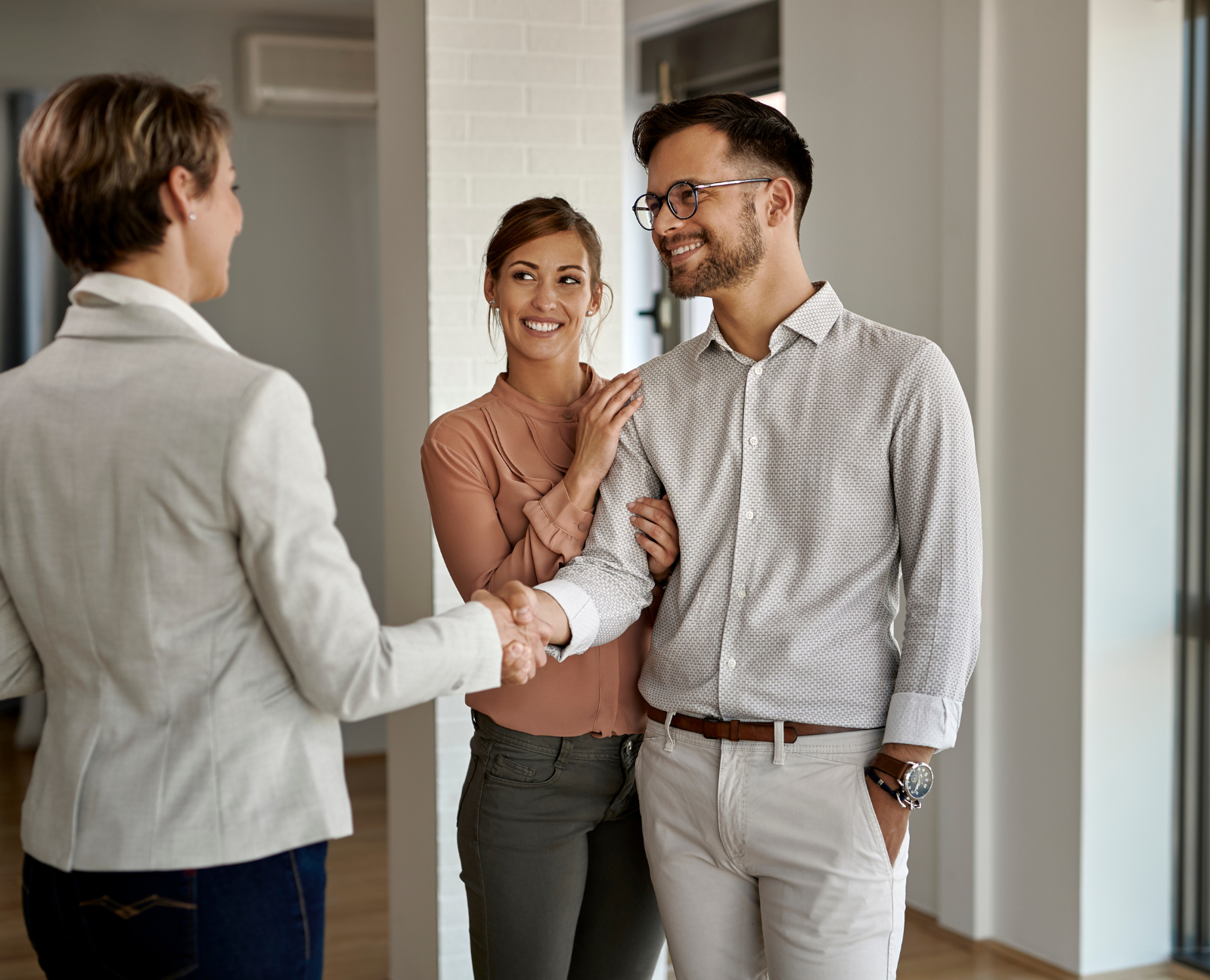 real estate agent talking to homebuyers