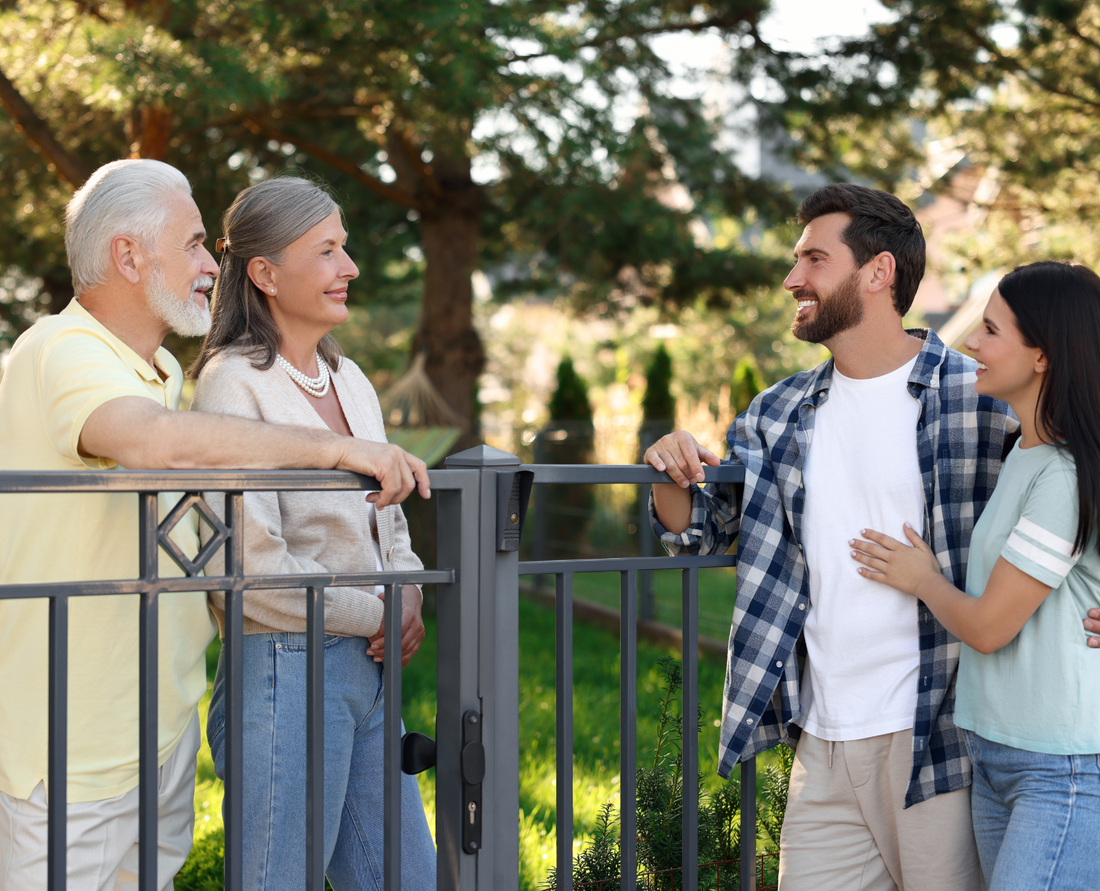 old couple talking to young couple in neighborhood
