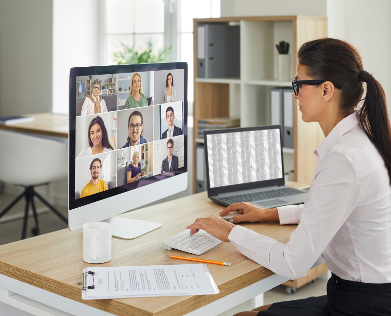 woman working from home having video chat with colleagues
