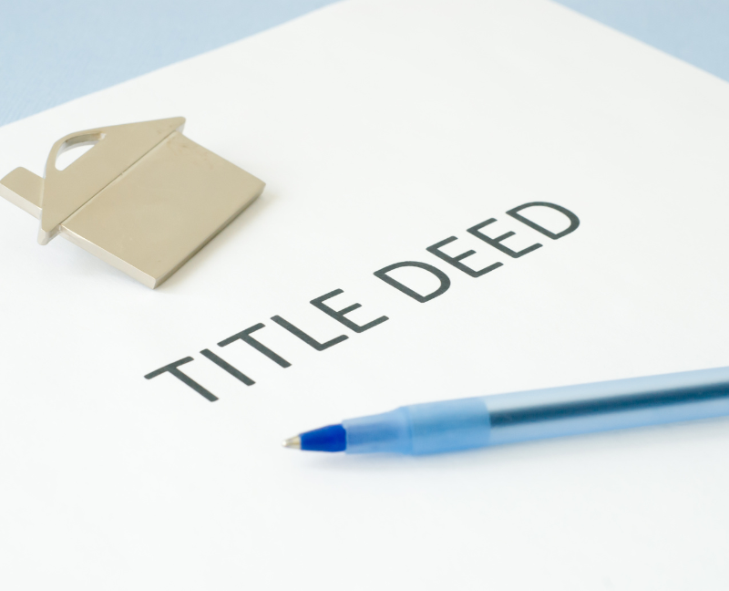 title deed with blue pen